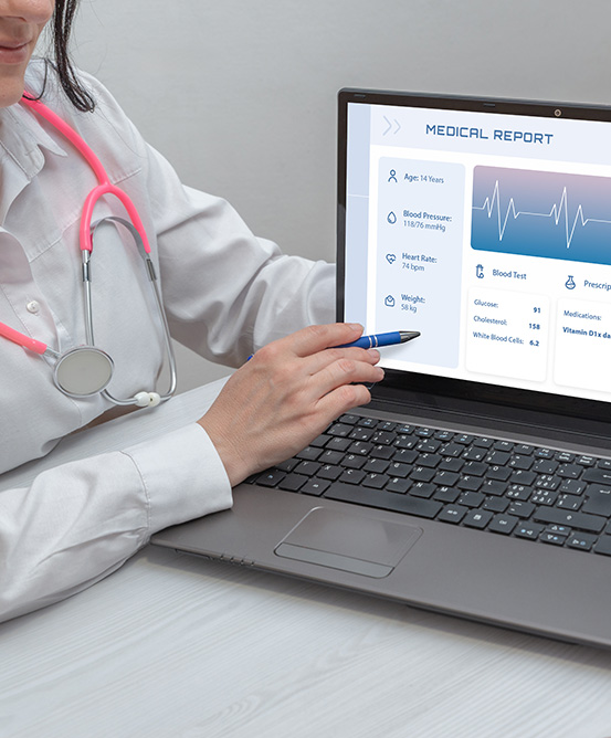 doctor presenting digital medical report on laptop to patient re